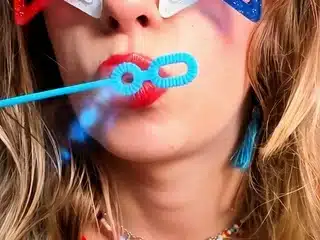 Petite Mercy – Poppy Red Lipstick Blowing Bubbles
